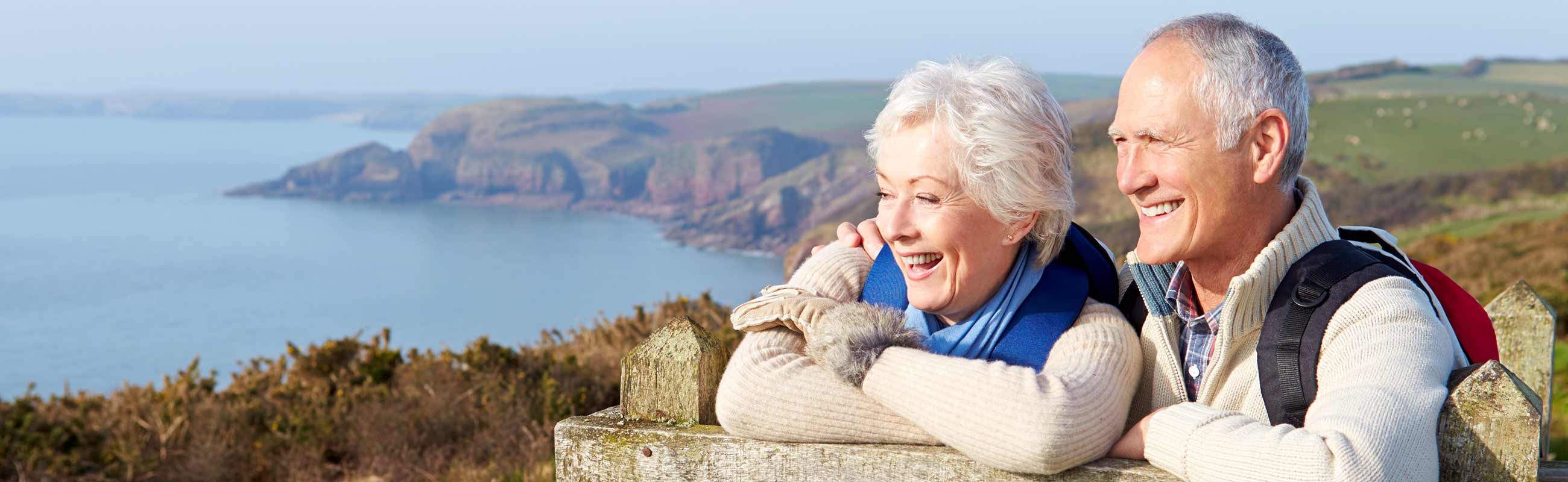 large image senior couple sightseeing at a California beach